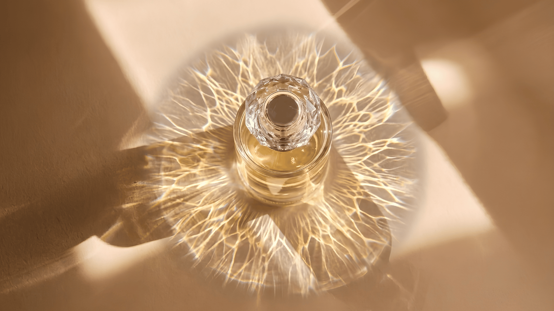 Notes Dubai - Aerial view of perfume bottle with reflective light